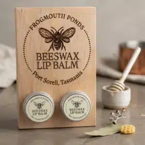 Frogmouth Ponds Beeswax Lip Balm display sign on antique counter with honeycomb and natural ingredients, Port Sorell Tasmania